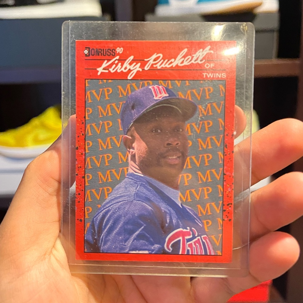 DONRUSS 90 KIRBY PUCKETT MVP CARD. CARD HAS LIVED IN HARD PLASTIC CASE.